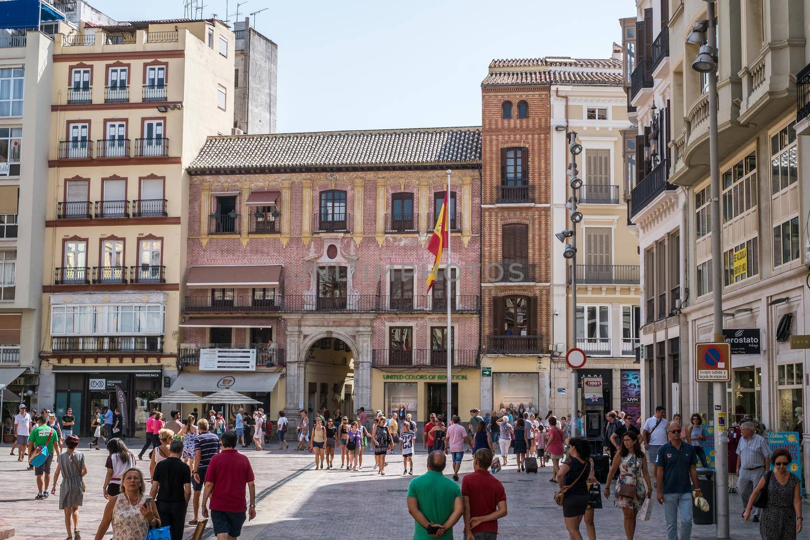 Malaga, Spain - August 04, 2018. iew of Main Square (Plaza de la Constitucion) in Malaga city, Andalusia, Spain. It's a popular shopping destination for tourists and locals