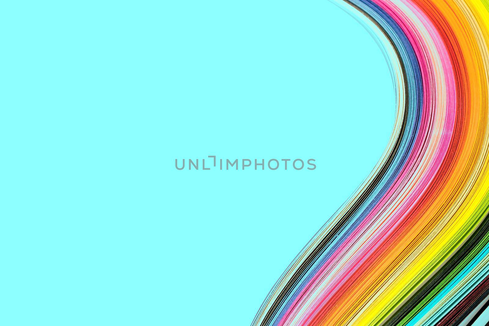 Abstract color wave curl rainbow strip paper on blue background