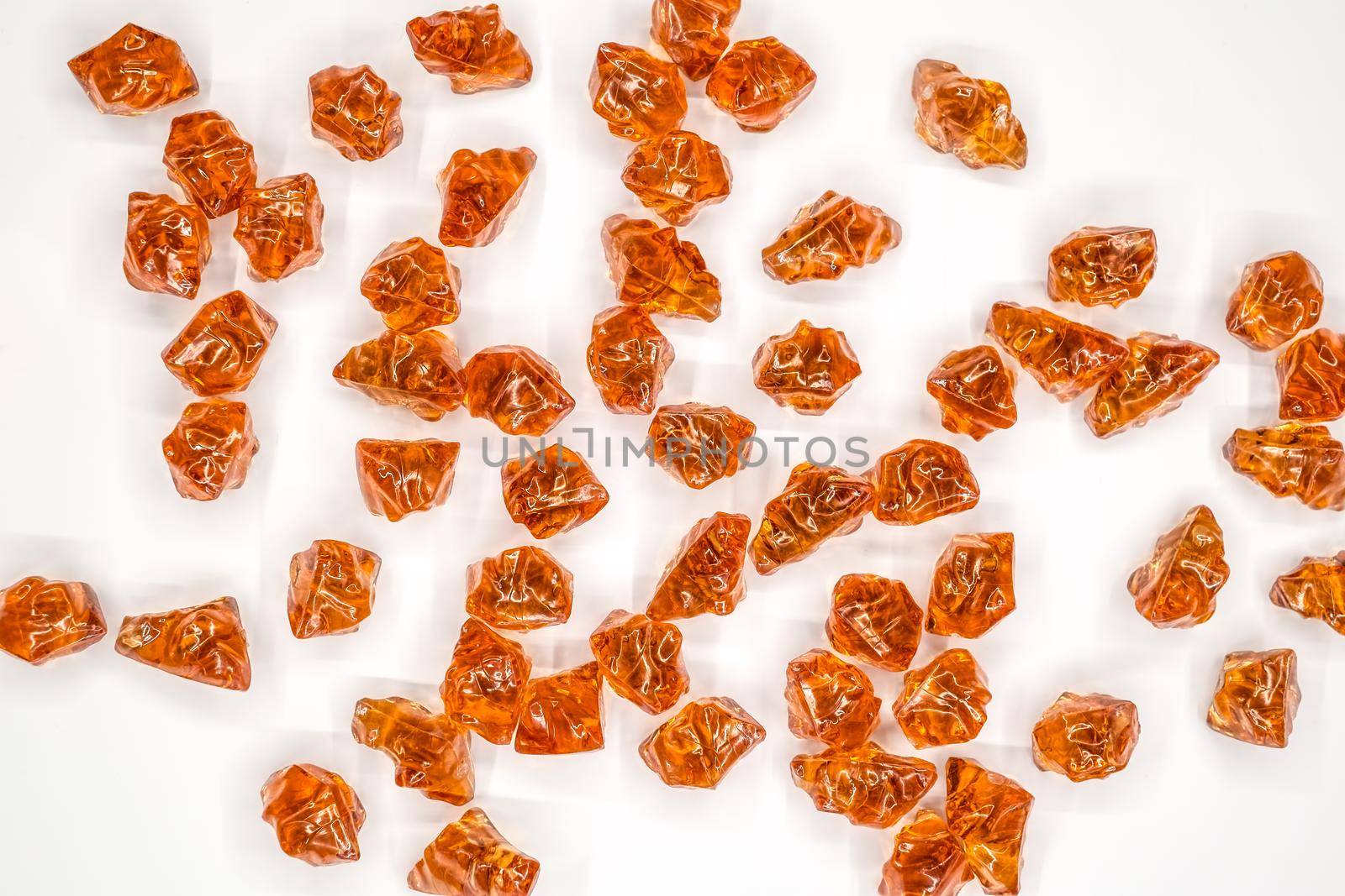 Baltic amber stones rectangular lie on a white background