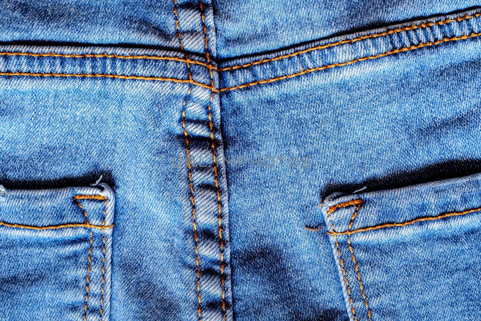 Details from jeans pants with seams and pockets by Roberto
