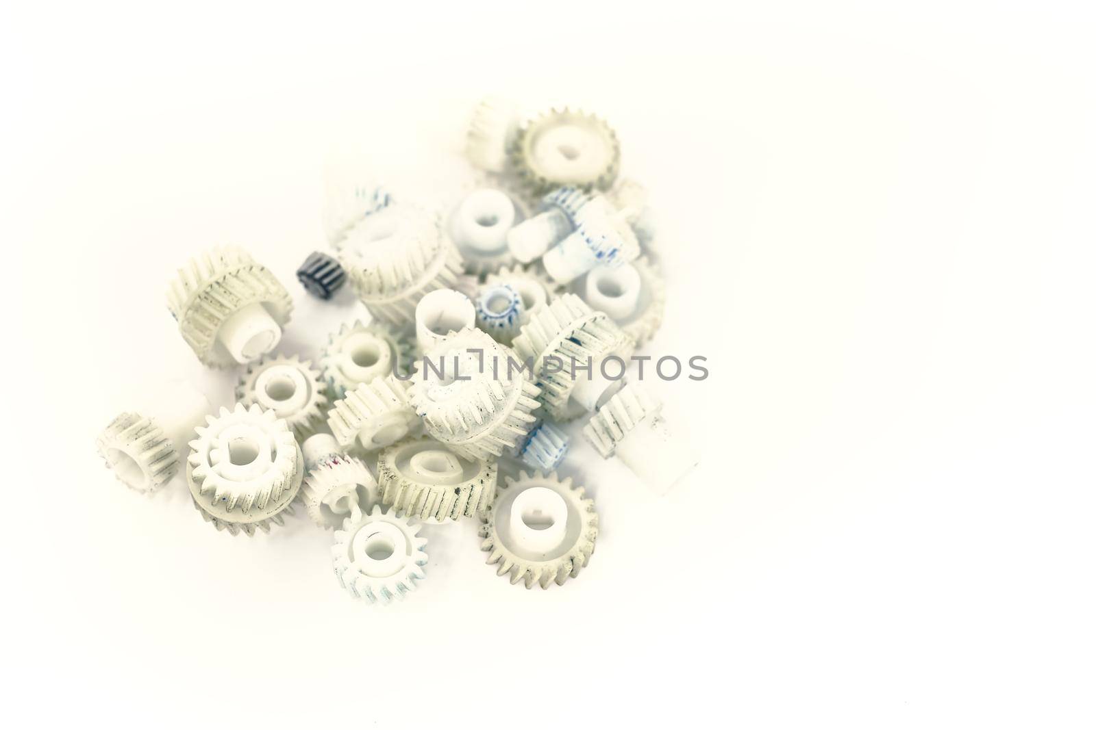 Dirty plastic gears on white background by Roberto