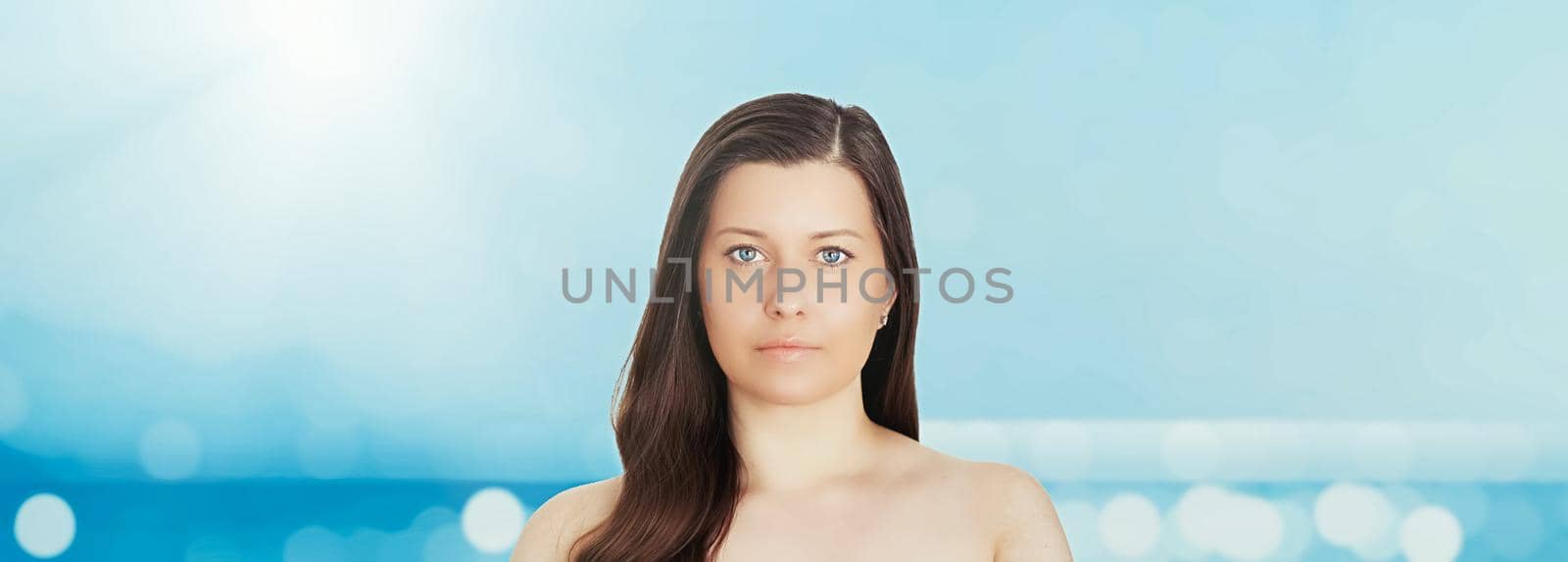 Skincare and sun protection in summer. Portrait of a beautiful young suntanned woman, blue sea and sky on background, beauty, wellness and travel concept by Anneleven