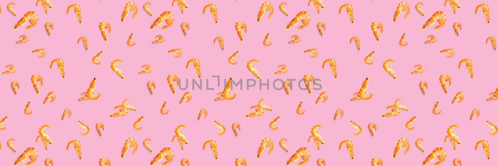 Tiger shrimp. Seafood background made from Prawns isolated on a pink backdrop. modern flat lay background from boiled shrimps, Seafood. not seamless pattern