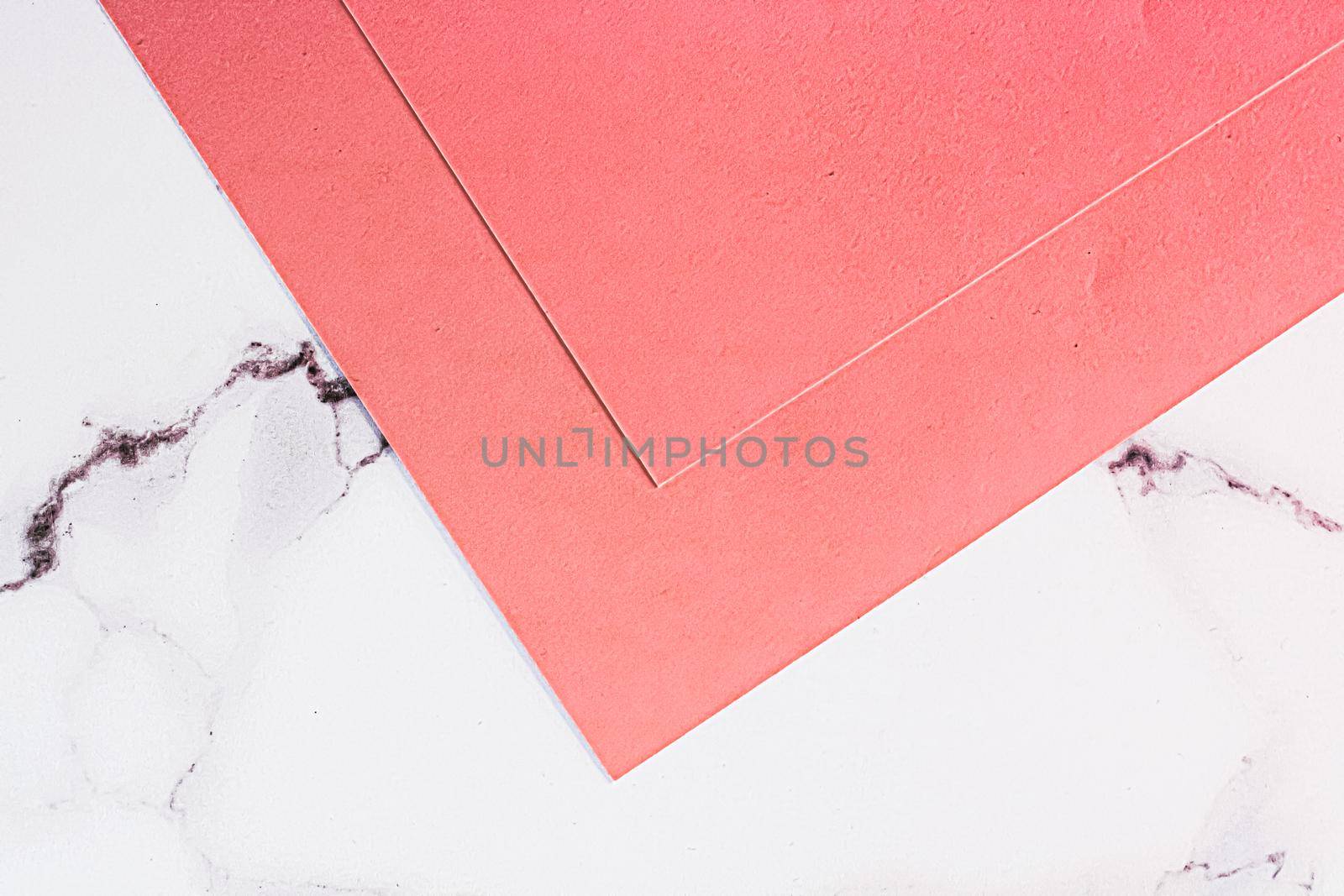 Pink A4 papers on white marble background as office stationery flatlay, luxury branding flat lay and brand identity design for mockups