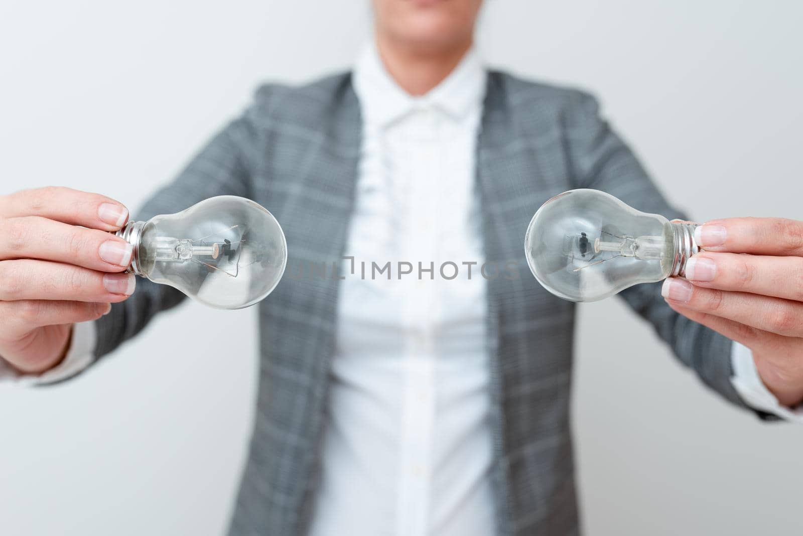 Lady Holding Two Lamps Upside Down With Outfit Proposing New Ideas For Project, Business Woman Carry 2 Bulbs Opposite Displaying New Technologies, Two Vise Versa Lamps Exhibiting Fresh Idea.