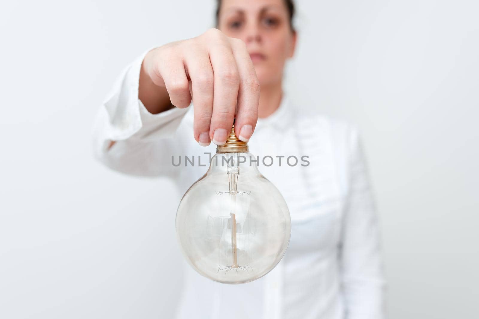 Lady Holding Lamp Upside Down In Shirt Presenting New Ideas For Project, Business Woman Carrying Bulb Opposite Showing Late Technologies, Vise Versa Lightbulbs Exhibiting Fresh Opinion.