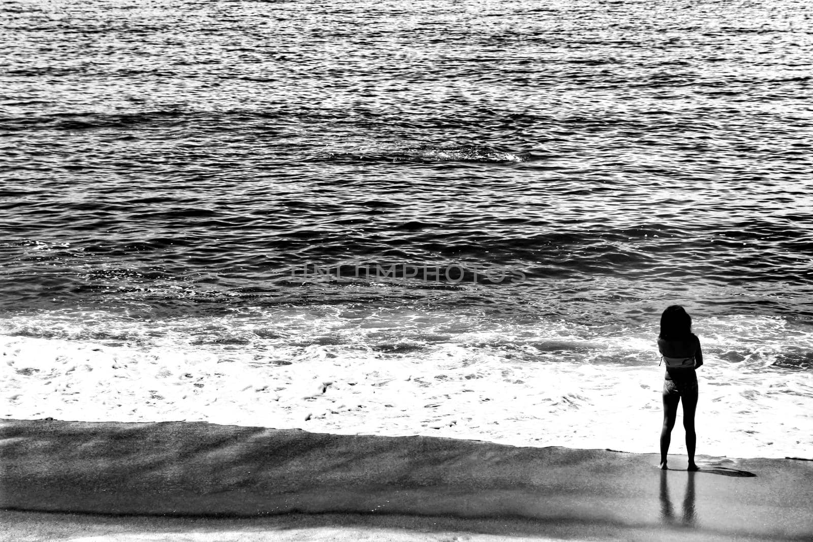 Sesimbra, Lisbon, Portugal- June 1, 2018: Views of the Sesimbra Beach and tourists watching the Atlantic Ocean in a sunny day.