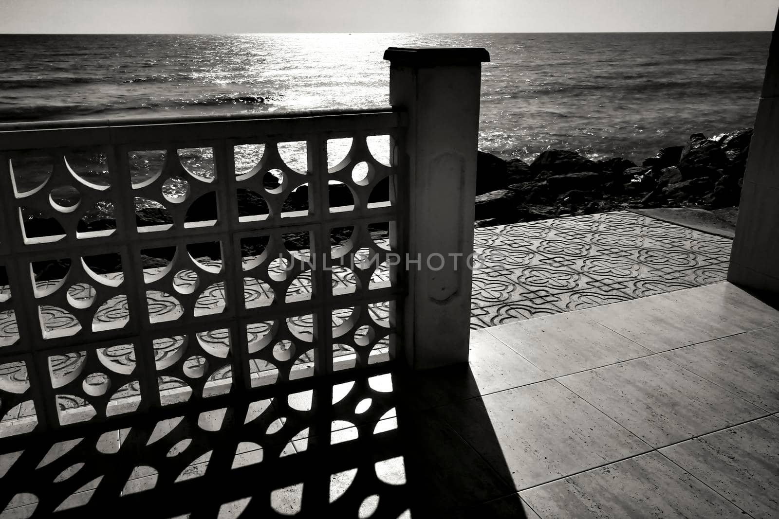 Architectural details of white typical spanish houses on the shore in Alicante, Spain. Monochrome picture.
