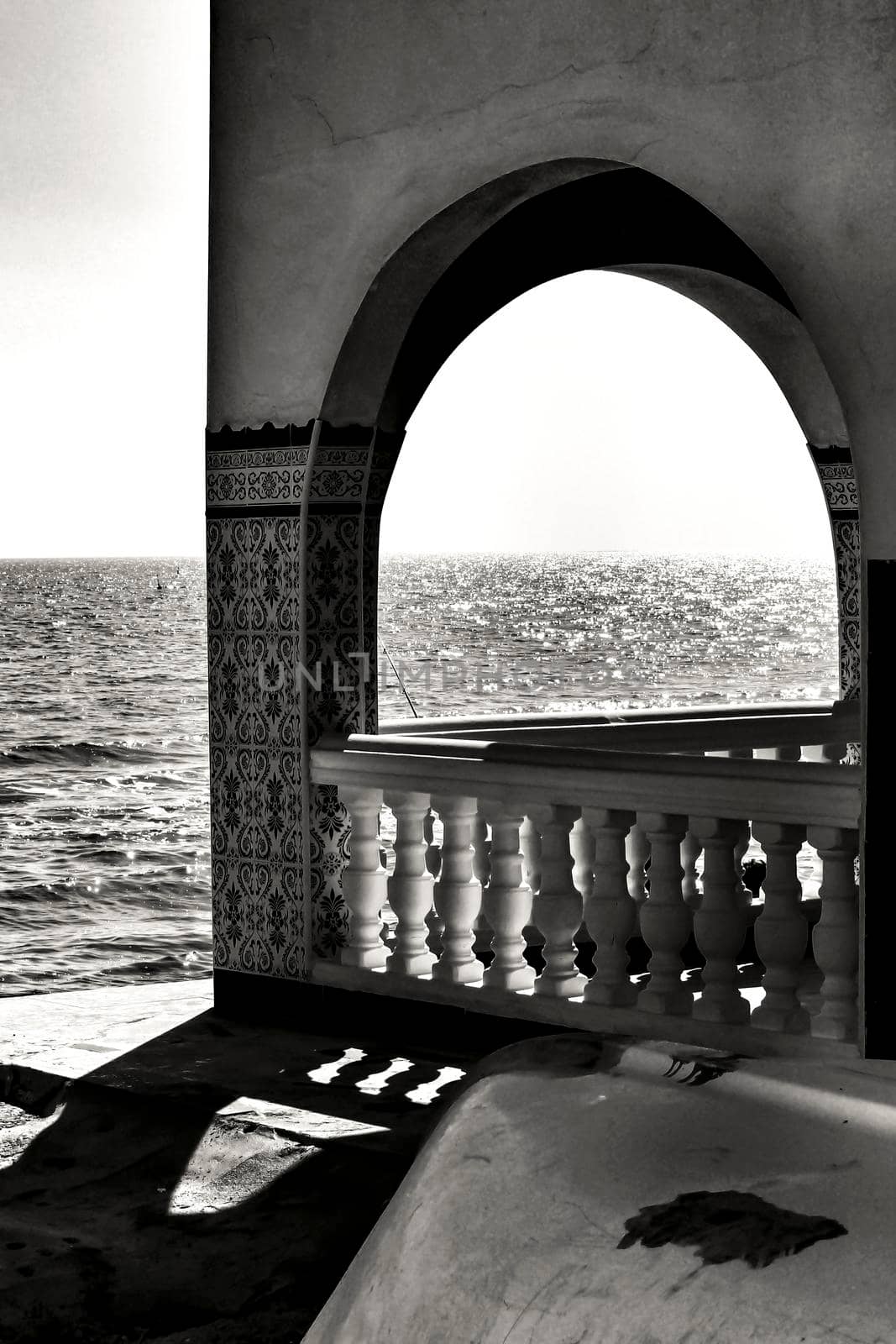 Architectural details of white typical spanish houses on the shore in Alicante, Spain. Monochrome picture.