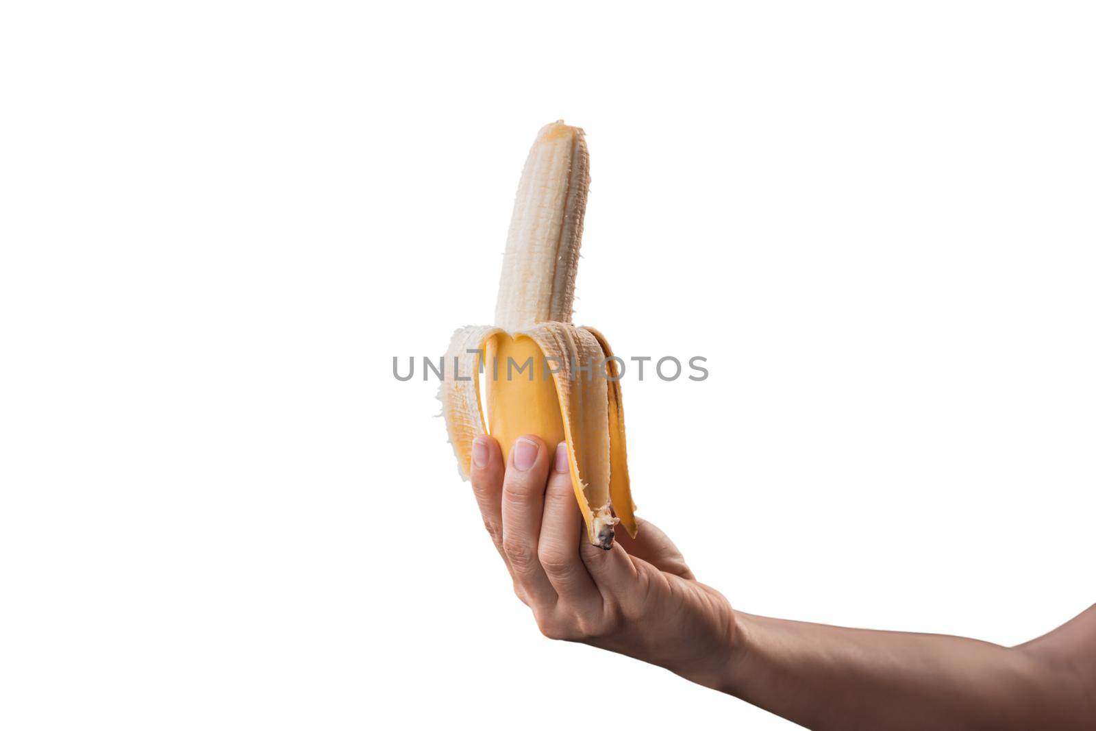 Closeup a woman's hand holding a ripe banana isolated on white background