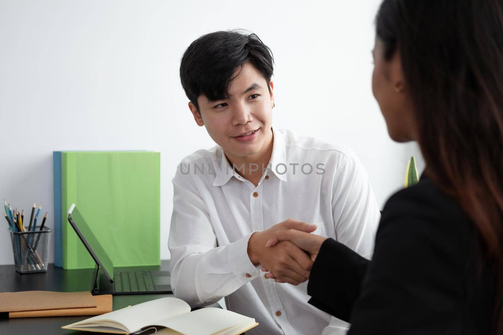 Businessman handshake for teamwork of business merger and acquisition,successful negotiate,hand shake,two businessman shake hand with partner to celebration partnership and business deal concept.