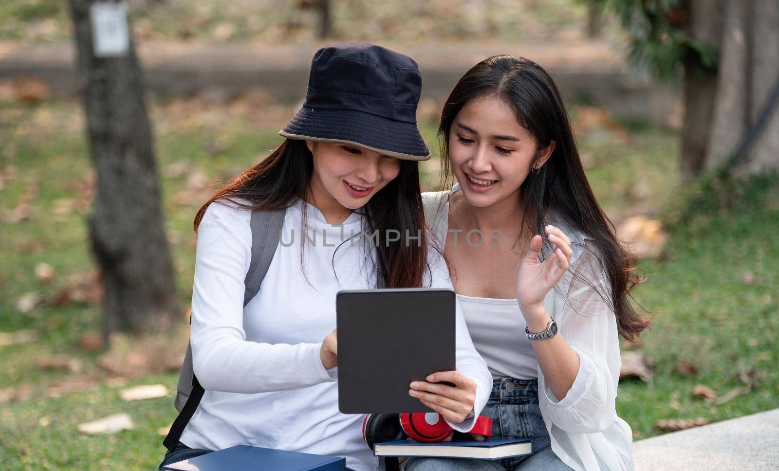 Group Of Asian Students Or Preparing For Lectures Outdoor, Studying With Tablet