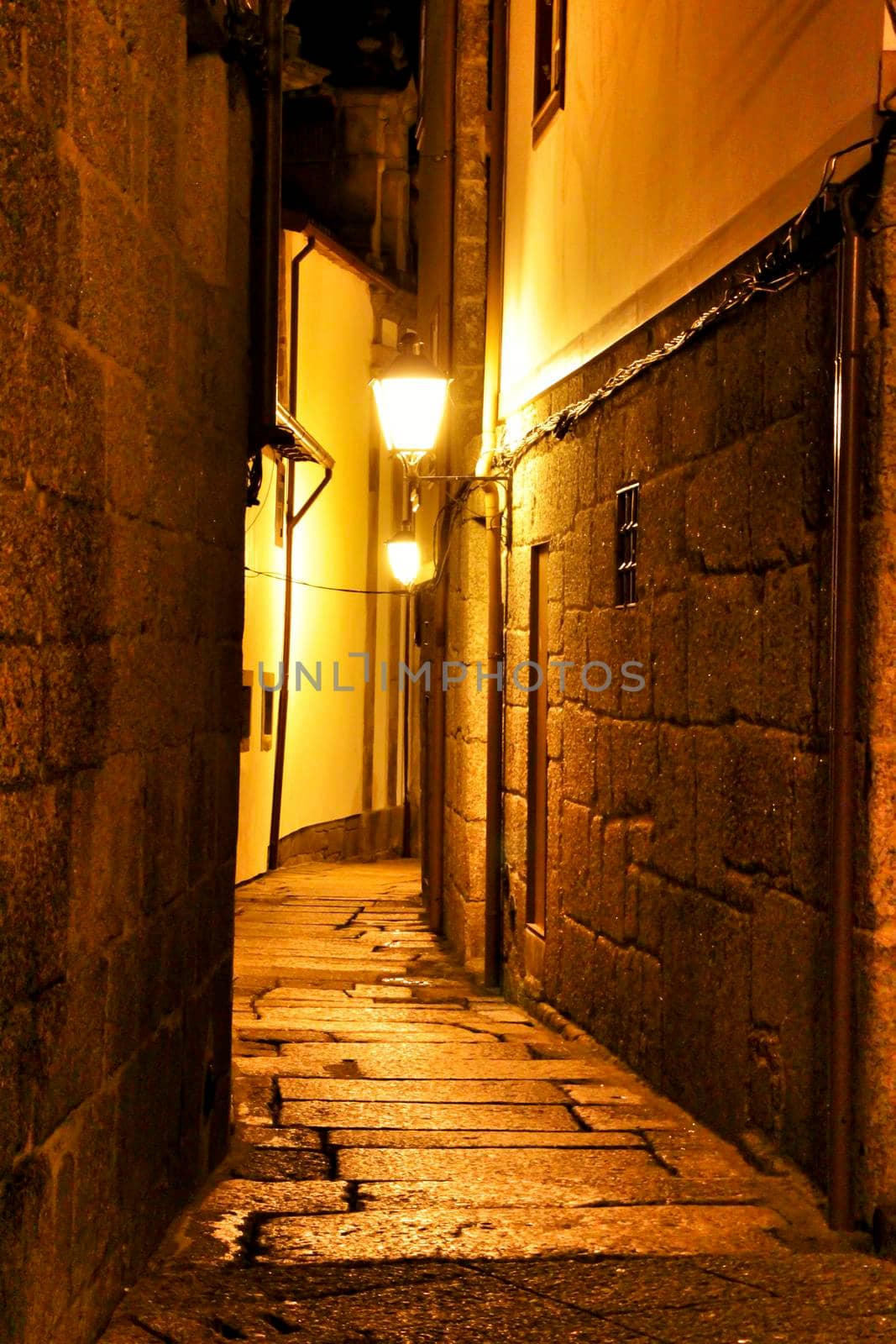 Beautiful streets and old stone facades of the portuguese medieval village of Guimaraes at night