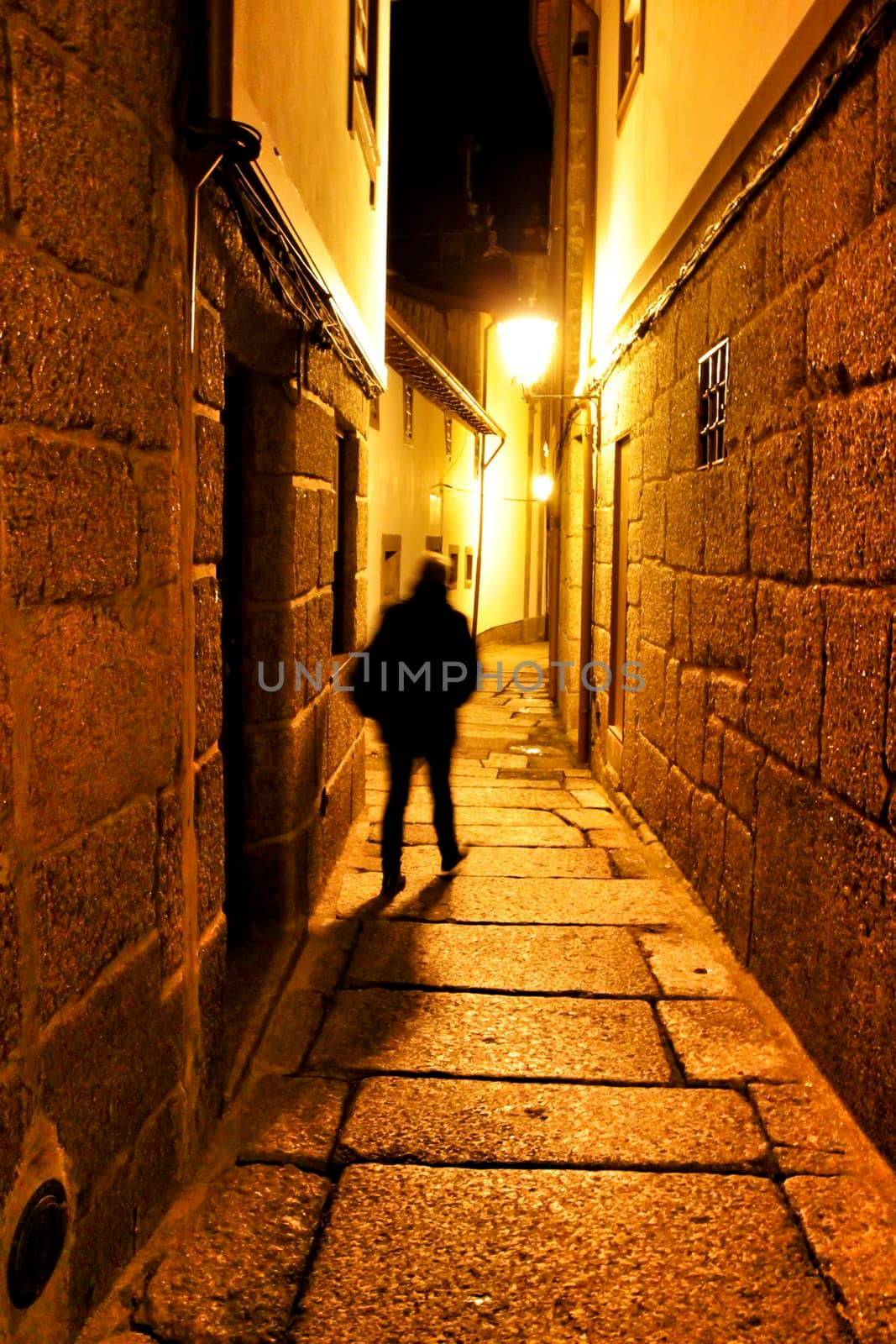 Beautiful streets and old stone facades of the portuguese medieval village of Guimaraes at night