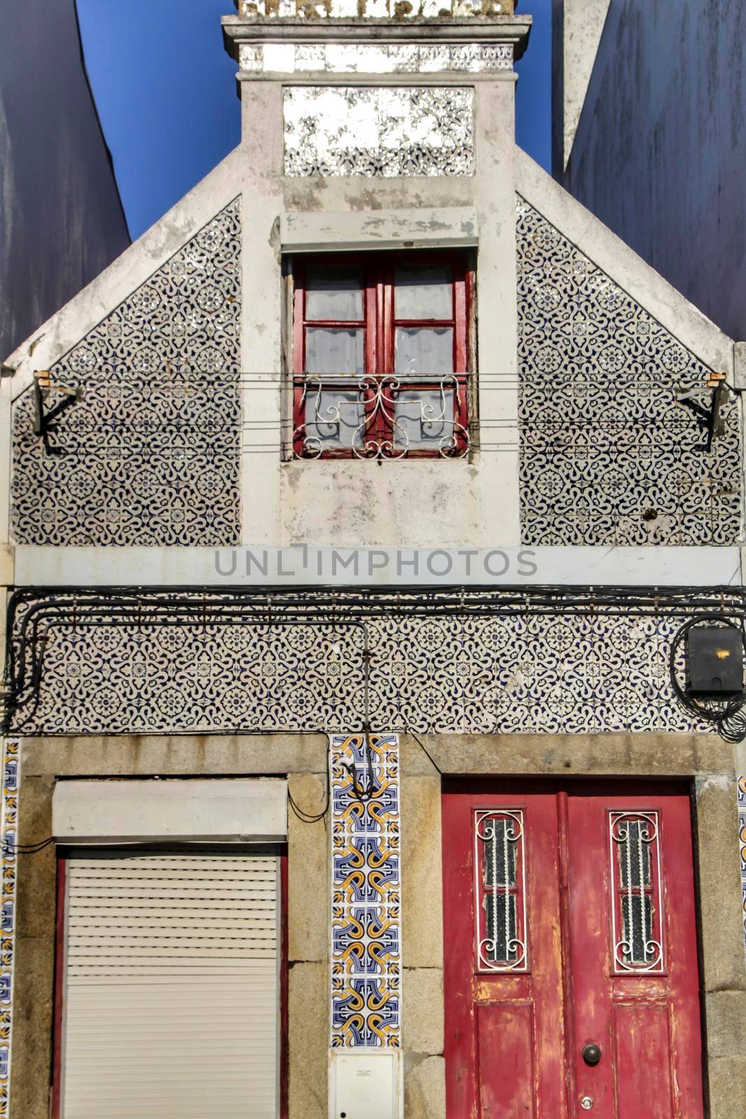 Beautiful and old colorful typical facades next to the water canal in Aveiro village in January