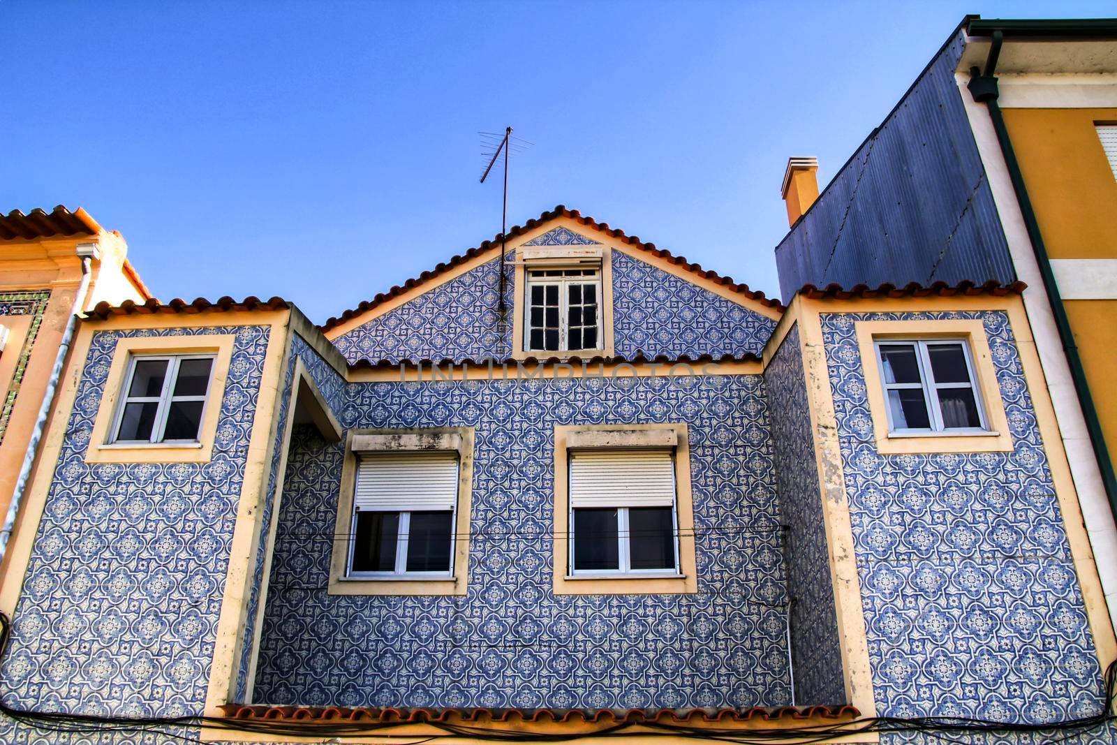 Beautiful and old colorful typical facades next to the water canal in Aveiro village in January