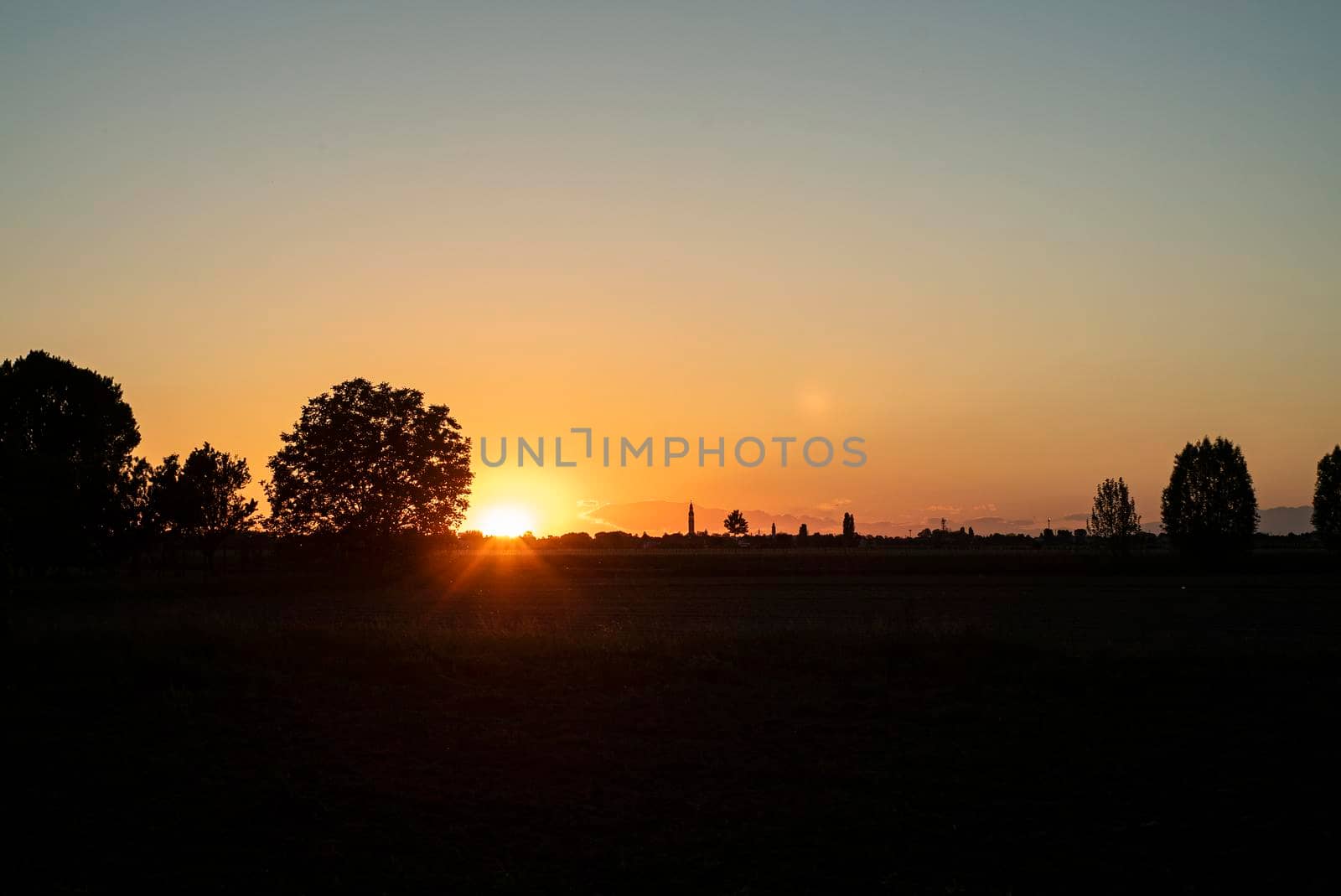 Sunset in countryside village in spring time in Italy