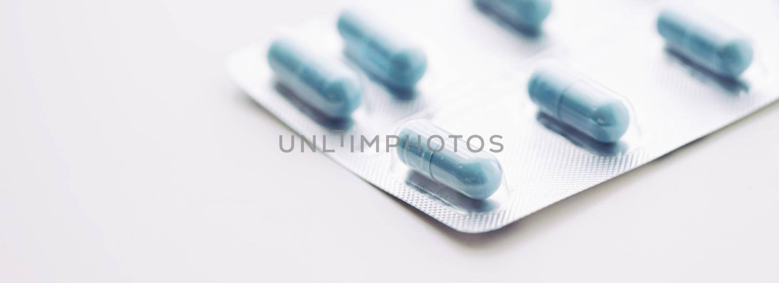 Blue pills and capsules as nutrition supplement, wellness and health care by Anneleven