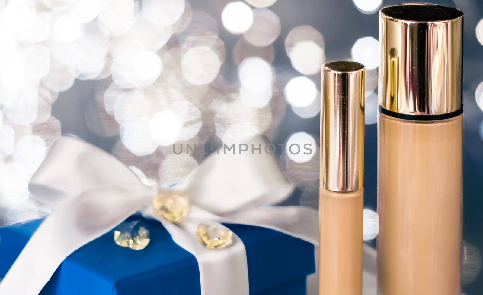 Cosmetic branding, Christmas glitter and girly blog concept - Holiday make-up foundation base, concealer and blue gift box, luxury cosmetics present and blank label products for beauty brand design