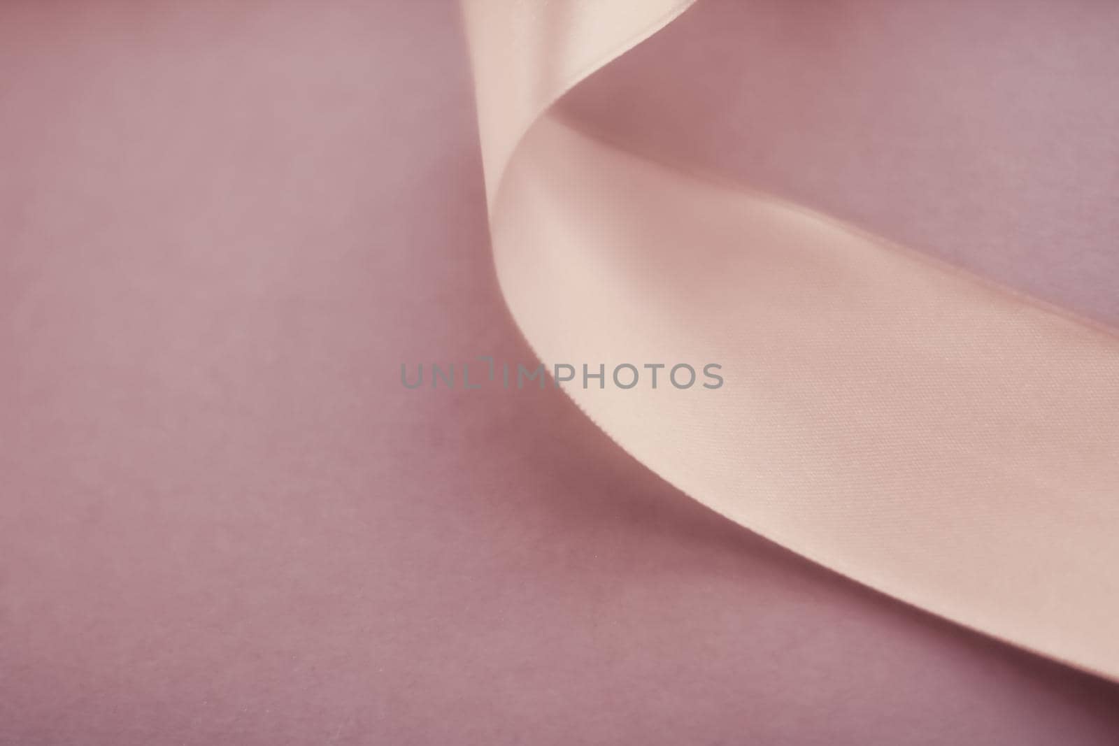 Branding, holidays and luxe brands concept - Abstract curly silk ribbon on pastel background, exclusive luxury brand design for holiday sale product promotion and glamour art invitation card backdrop