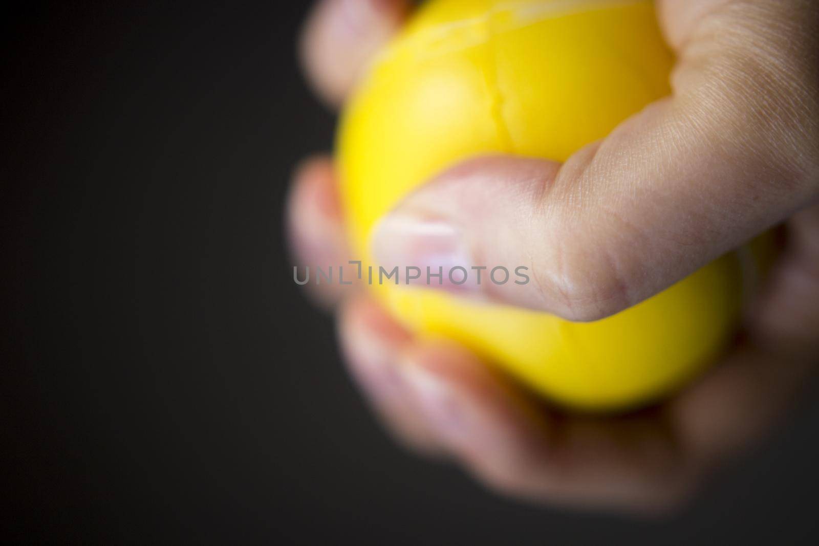 Exercises with one hand and yellow physiotherapy ball