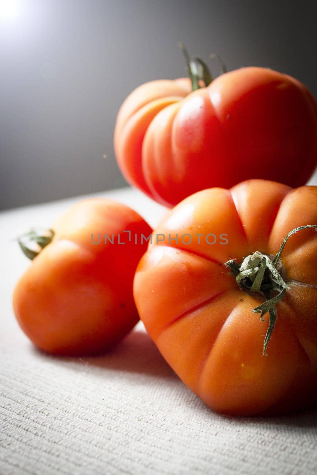 Group of uncooked raw red tomatoes. Raw food