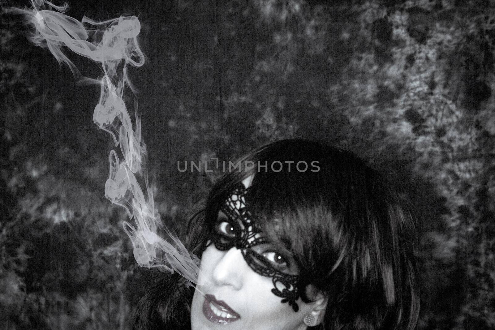 Woman disguised in gothic style for halloween party with mask