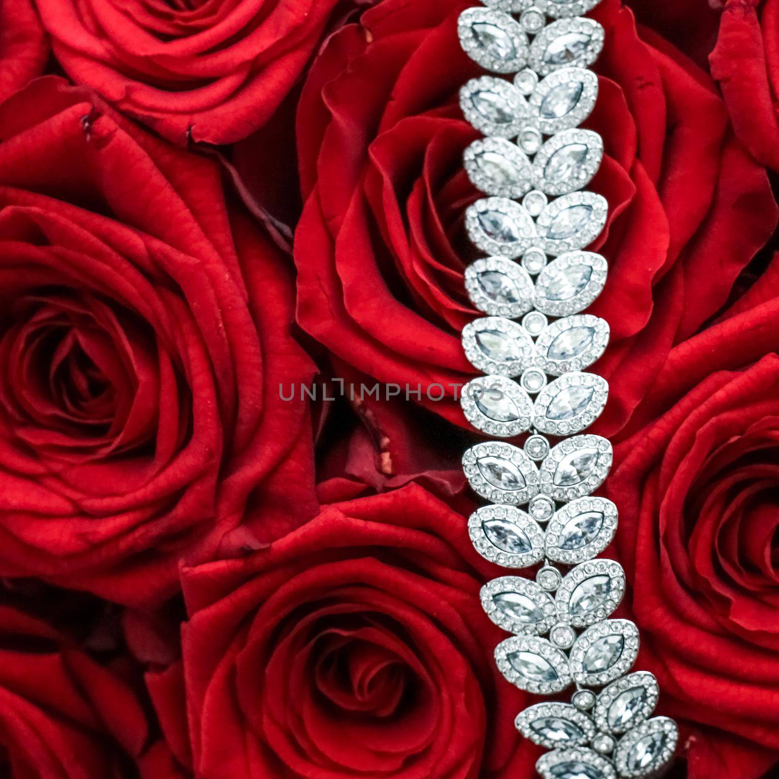 Gemstone jewellery, wedding fashion and luxe shopping concept - Luxury diamond bracelet and bouquet of red roses, jewelry love gift on Valentines Day and romantic holidays present