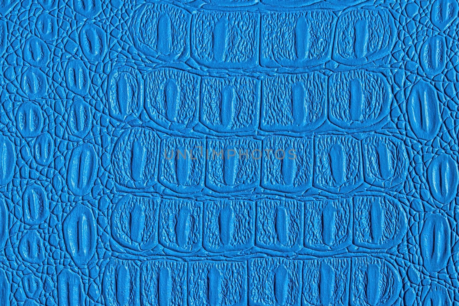 Blue crocodile leather texture. Abstract background for design.