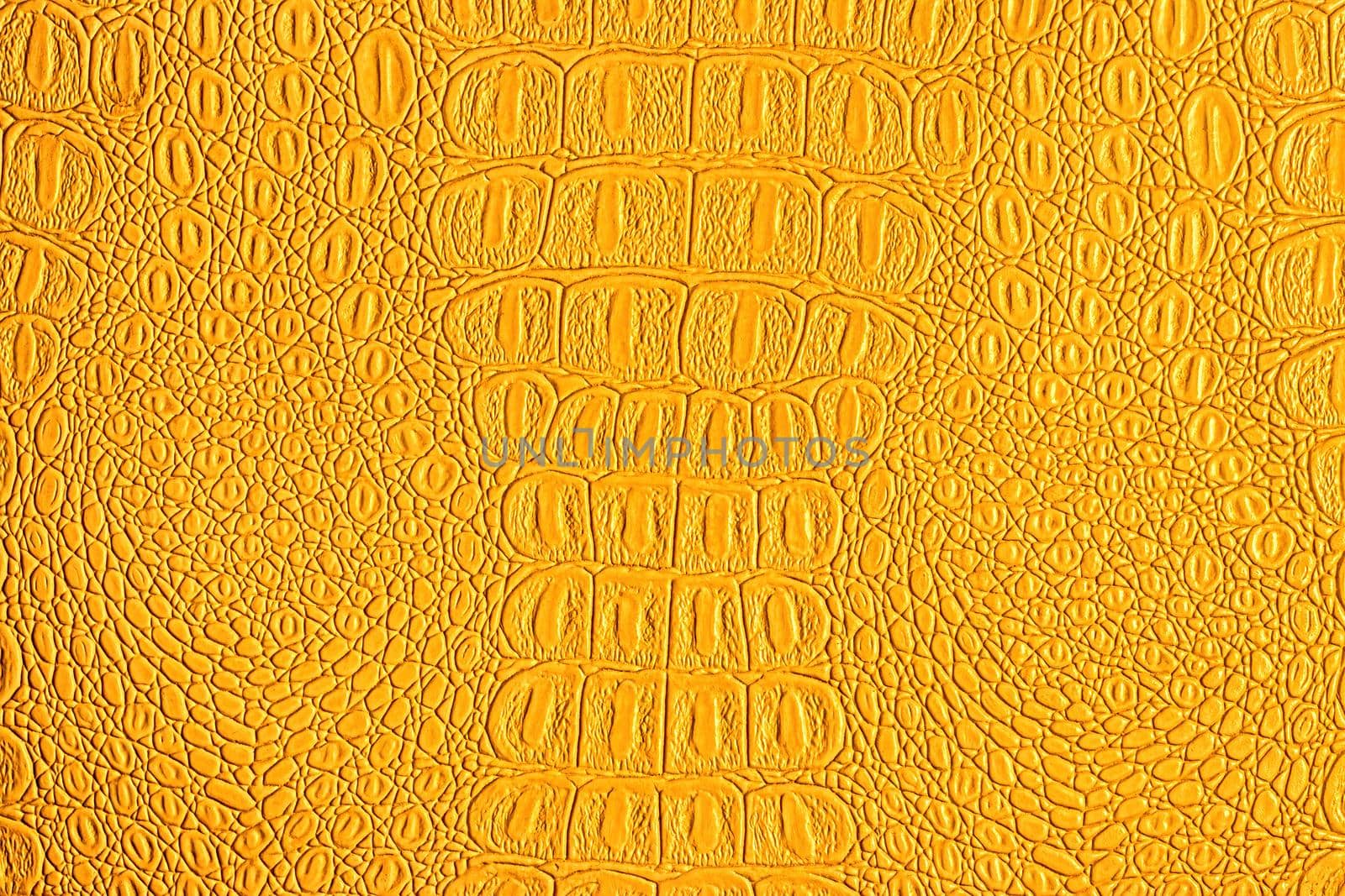 Orange crocodile leather texture. Abstract background for design.