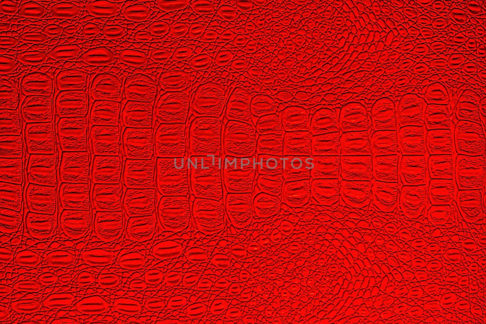 Red crocodile leather texture. Abstract background for design.