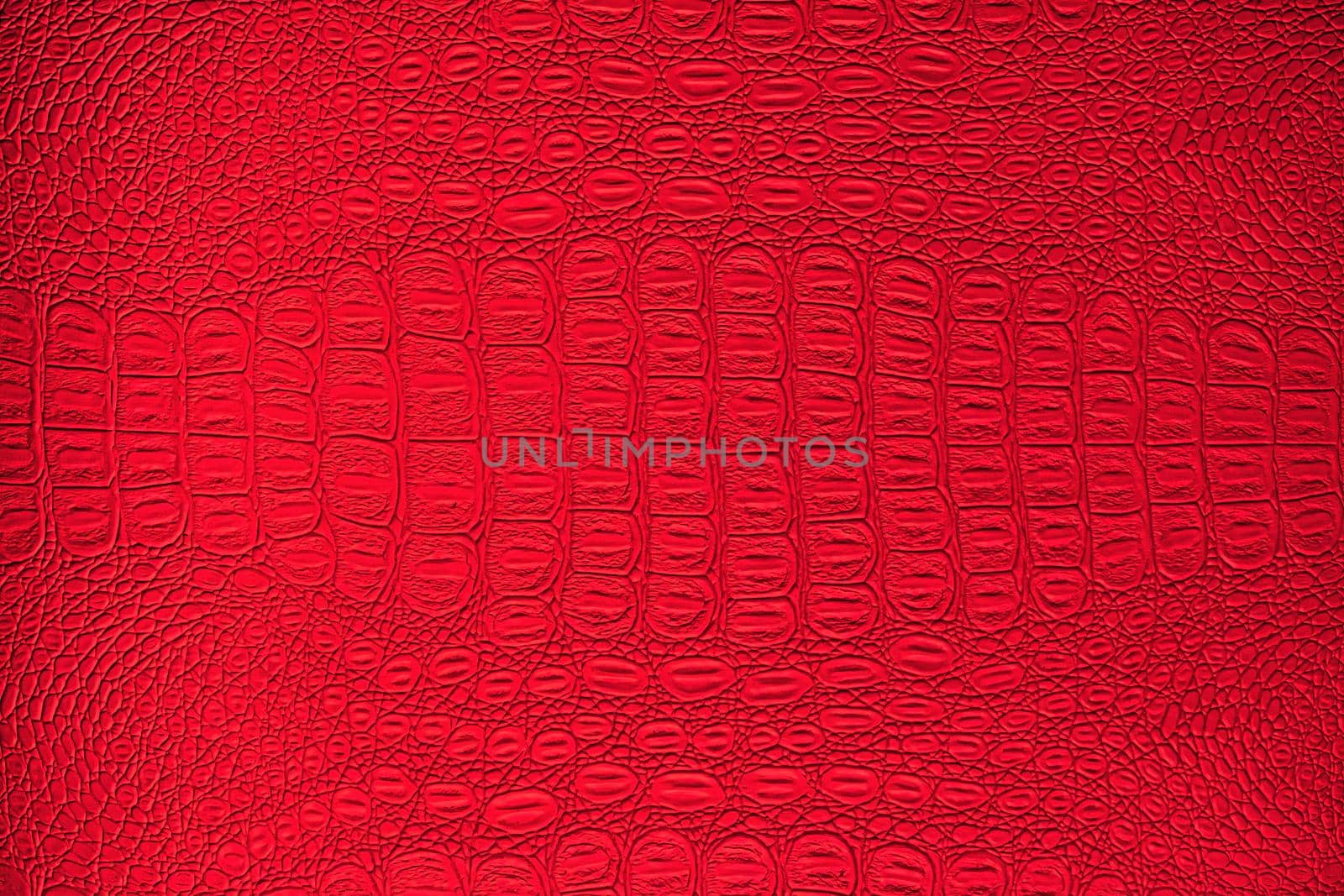 Red crocodile leather texture. Abstract background for design.