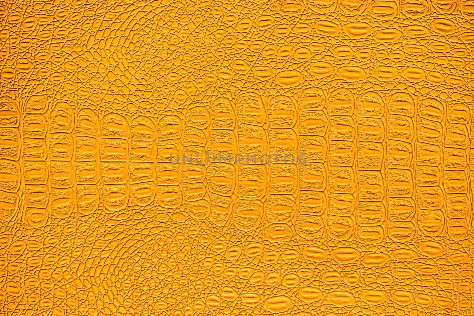 Orange crocodile leather texture. Abstract background for design.