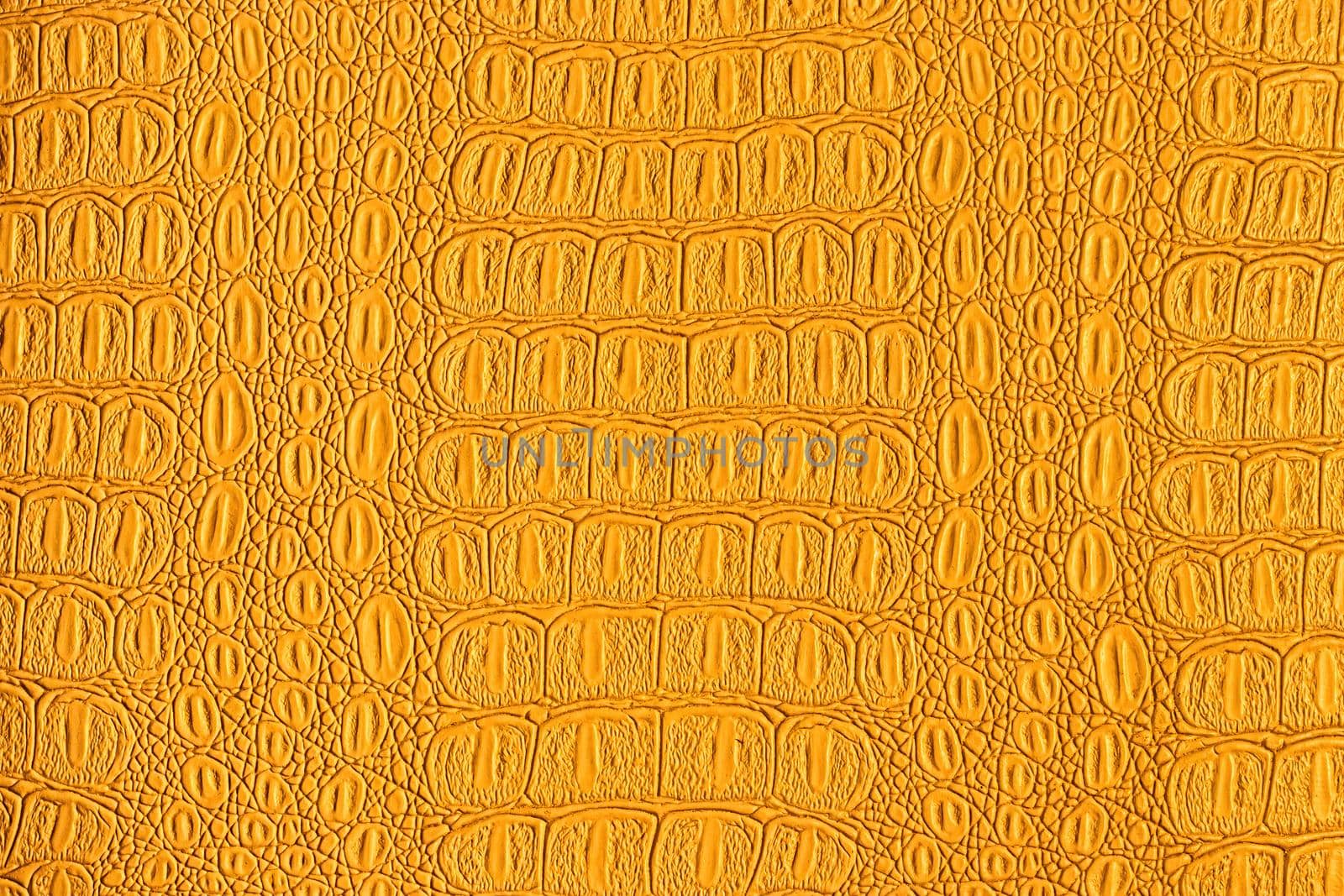 Orange crocodile leather texture. Abstract backdrop for design. by Eugene_Yemelyanov