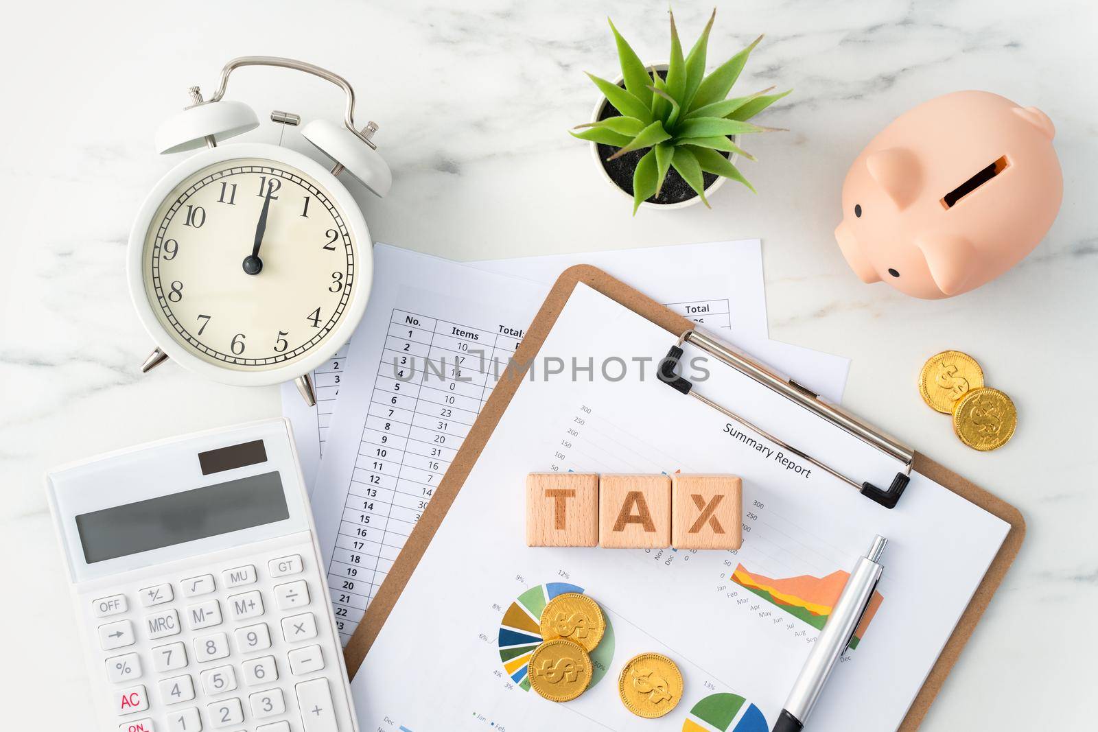 Top view of reading the overview and calculating, paying tax concept on marble white table.