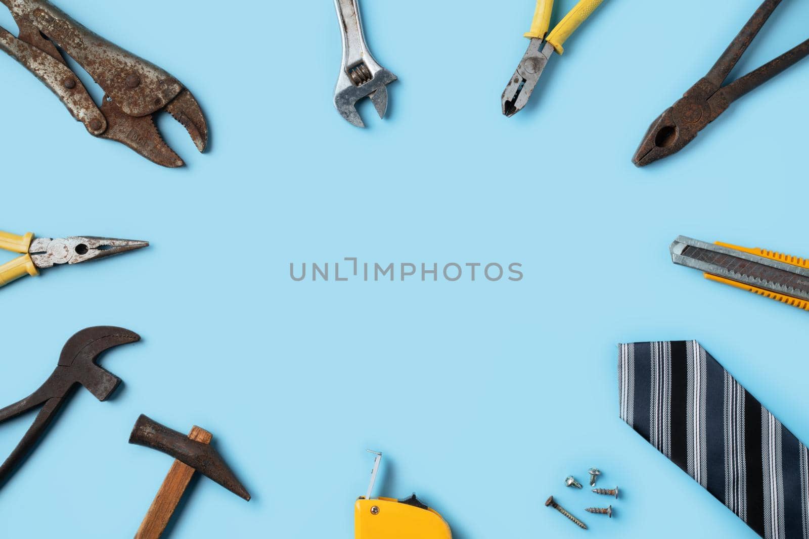 Top view design concept of Father's day and labor day with working tools on blue background.