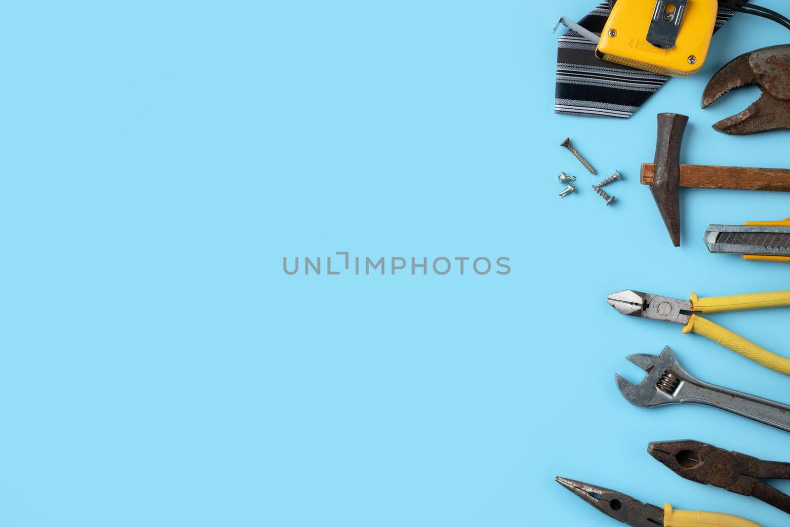 Top view design concept of Father's day and labor day with working tools on blue background.