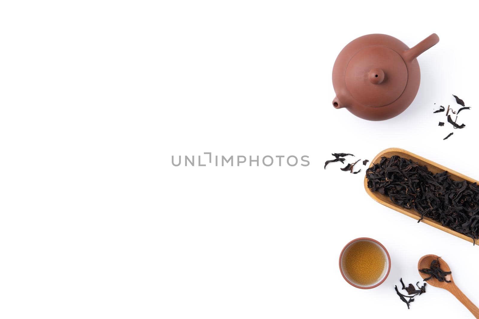 Top view of fresh black tea with kettle teapot and leaves in Taiwan, Asian culture design concept layout.