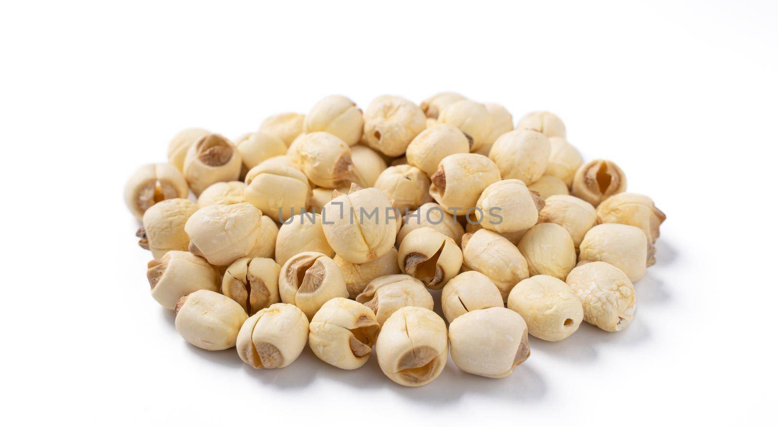 Close up of dried lotus seed Chinese herbal healthy food isolated on white table background