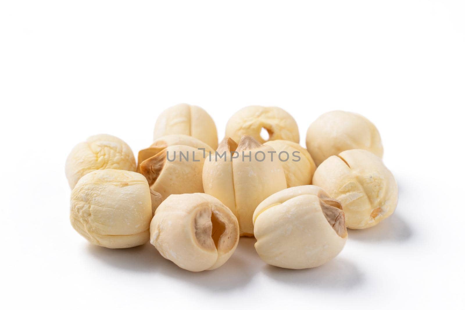 Close up of dried lotus seed Chinese herbal healthy food isolated on white table background