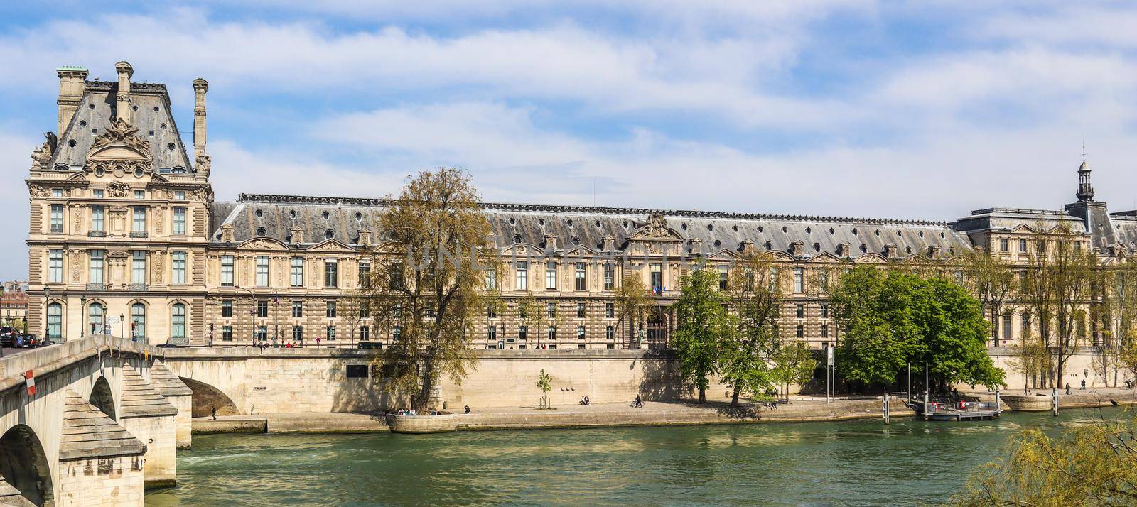 Beautiful historic buildings of Paris and one of the oldest bridge ( Pont Royal ) across Seine River. France. April 2019