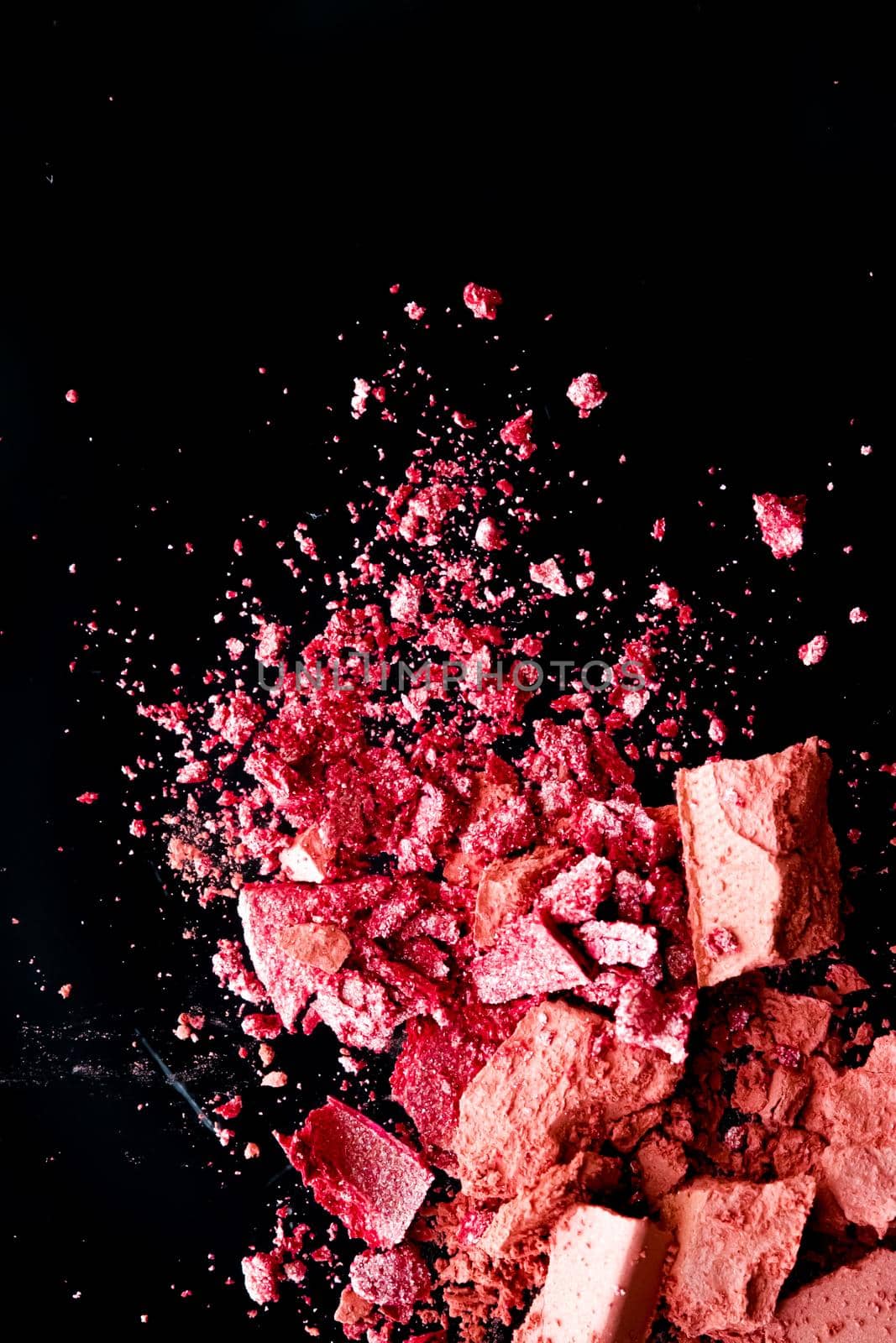 Crushed cosmetics, mineral organic eyeshadow, blush and cosmetic powder isolated on black background, makeup and beauty banner, flatlay design.