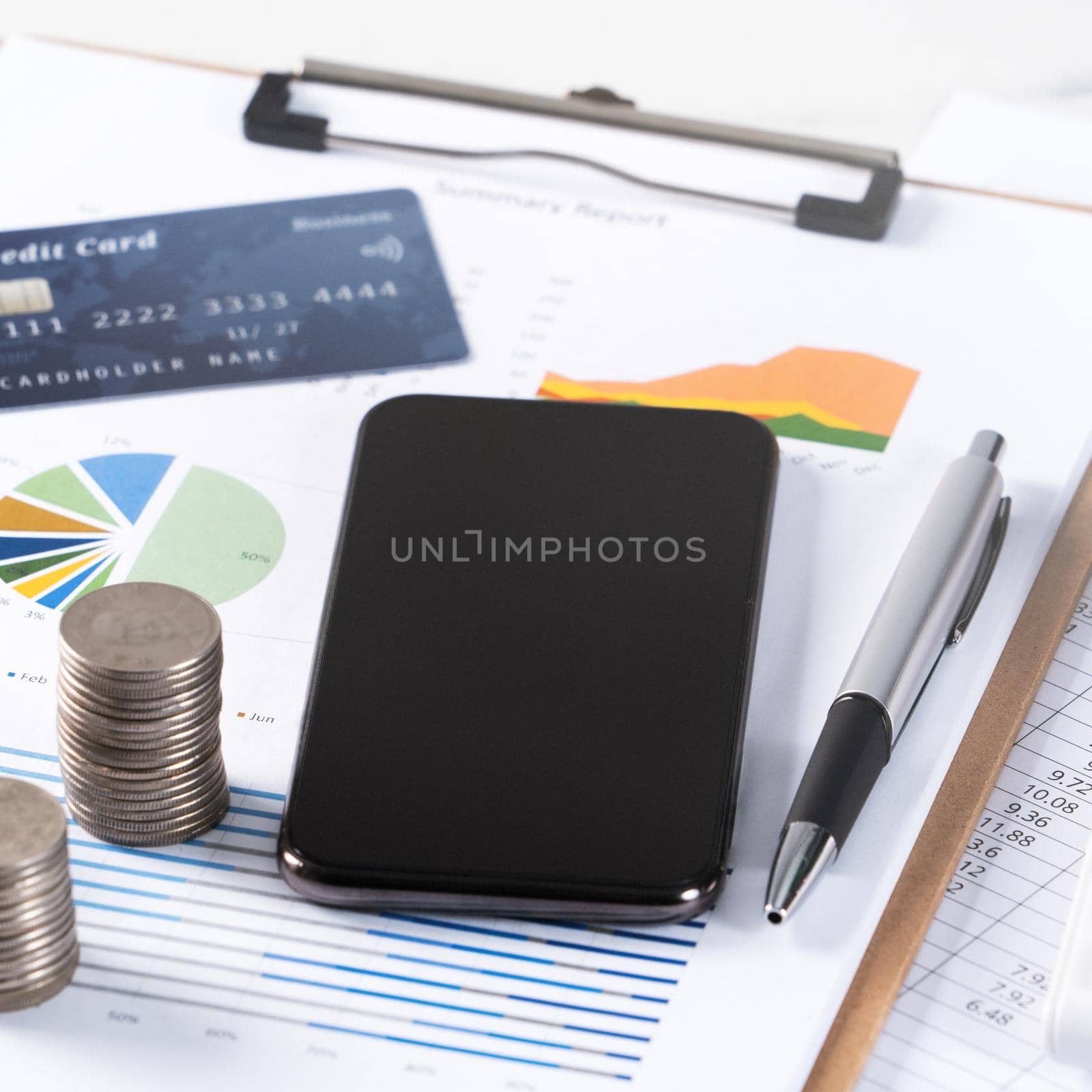 Design concept of annual summary analysis review report with calculator, paying with electronic device and credit card.