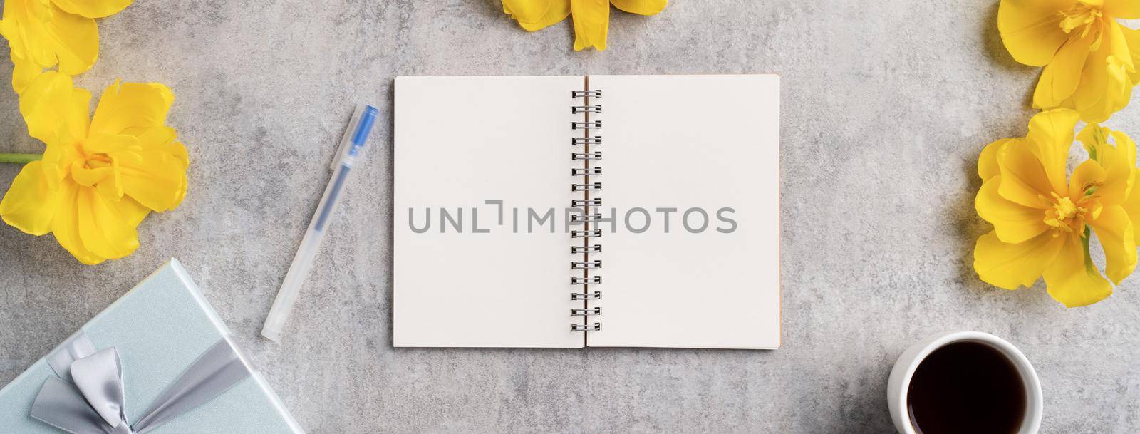 Concept of Mother's day holiday gift idea greeting design with yellow tulip flower bouquet on gray background