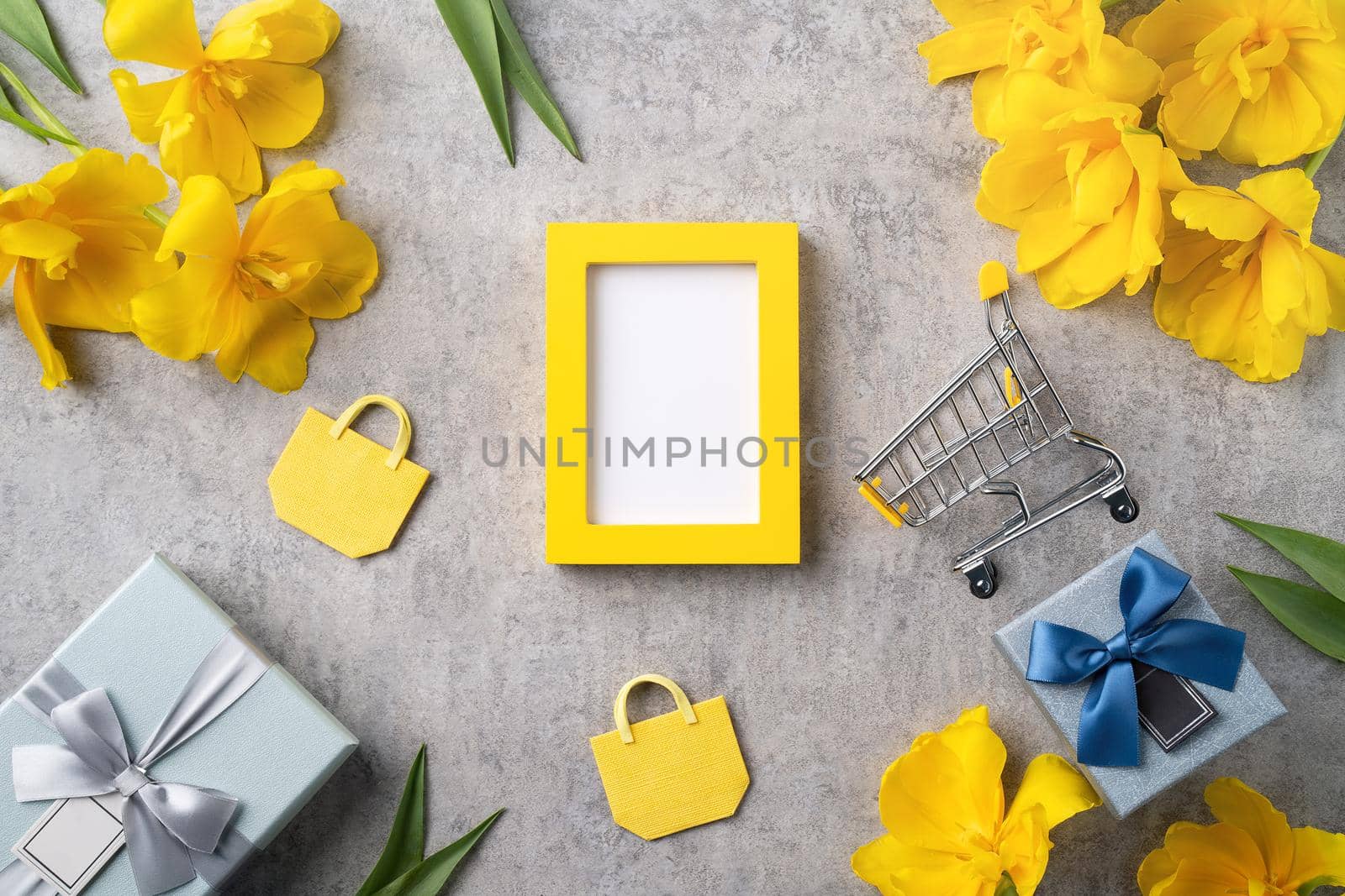 Concept of Mother's day holiday gift shopping greeting design with yellow tulip flower bouquet on gray background
