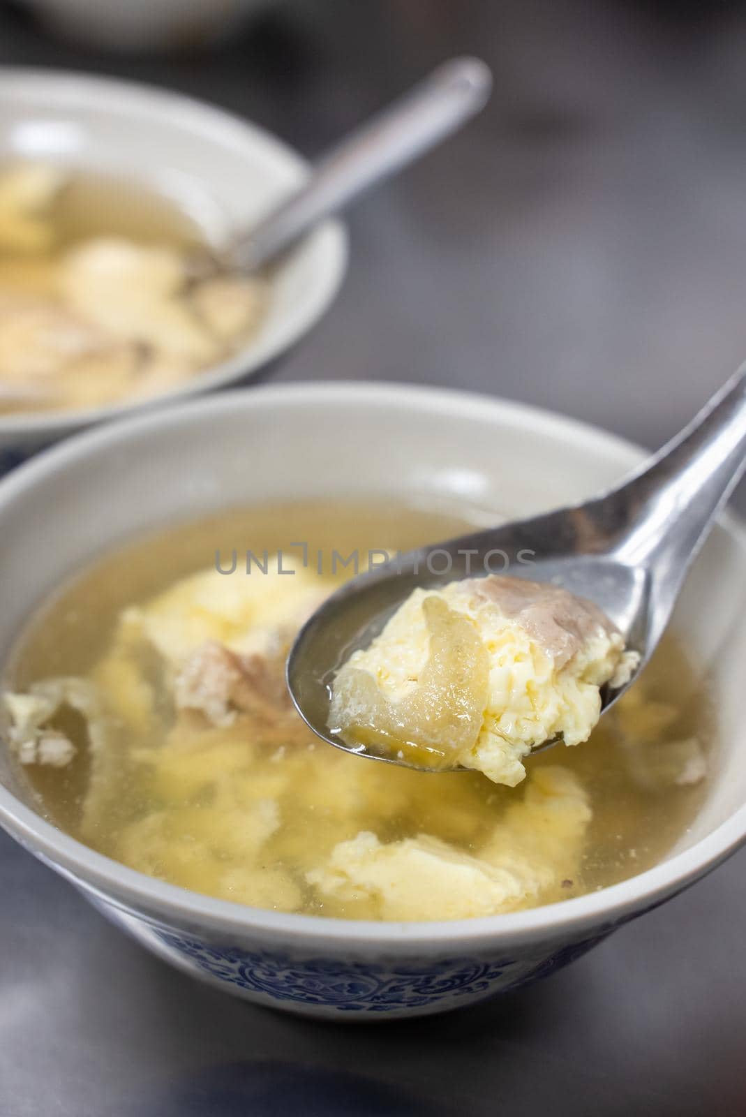 Delicious street food pig bone marrow soup with boiled egg drop in Changhua, Taiwan.