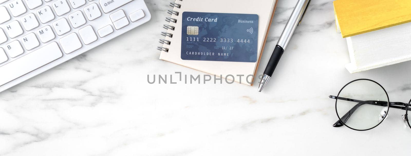 Top view of estimating and paying house tax with calculator and credit card from internet.