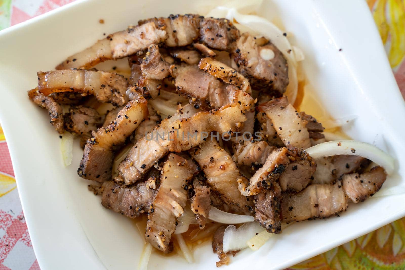 Close up of delicious Taiwanese salted pork food with onion in restaurant.