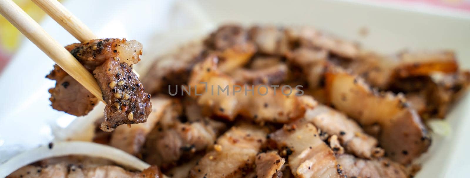 Close up of delicious Taiwanese salted pork food with onion in restaurant.