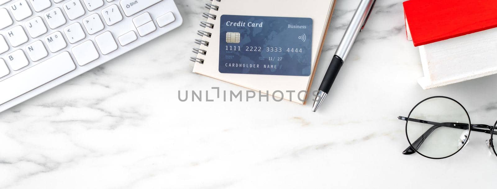 Top view of estimating and paying house tax with calculator and credit card from internet.